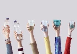 group of people holding up glasses of water | Virtual Resort Manager