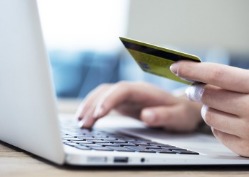 women shopping online with credit car in hand | Virtual Resort Manager